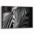 Framed canvas wall art showcasing a striking black and white zebra design, perfect for animal lovers and modern decor enthusiasts. Ideal for enhancing living spaces with a touch of wildlife elegance.