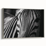 Framed canvas wall art showcasing a striking zebra design in silver tones, perfect for modern decor. Ideal for animal lovers and wildlife enthusiasts.