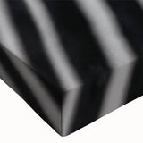 Close-up of a vibrant zebra wall art design on stretched canvas, showcasing intricate black and white patterns. Ideal for wildlife-themed decor, bringing nature indoors.