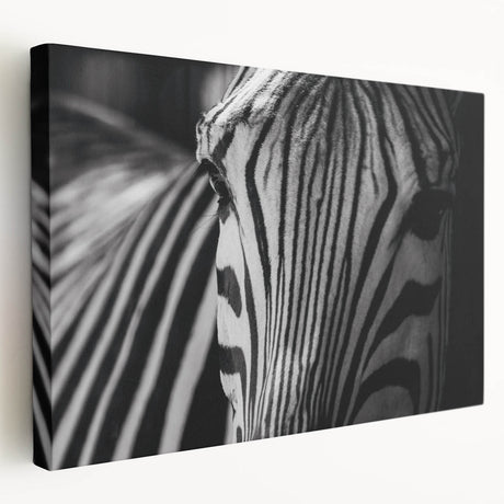 Side view of a stretched canvas wall art featuring a striking zebra design, showcasing intricate black and white stripes, ideal for wildlife-themed decor.
