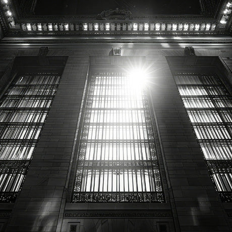 Black and white architectural abstract wall art featuring tall arched windows with dramatic sunlight