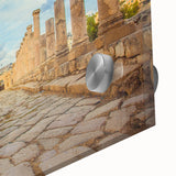 Close-up of large abstract wall art depicting ancient ruins in muted earth tones on acrylic glass.