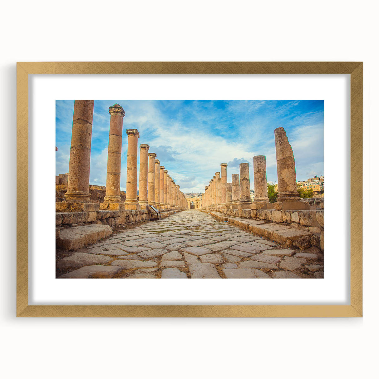 Textured art print of abstract ancient ruins in muted earth tones on a gold-framed canvas, suitable for bedroom decor.