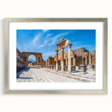 Textured art depicting ancient ruins in muted earth tones, framed in silver, ideal for bedroom ambiance.