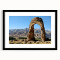 Colorful abstract art print featuring textured ancient ruins, in a black frame with mat, ideal for living room decor.