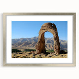 Textured art print of abstract ancient ruins in muted earth tones, framed in silver, ideal for bedroom art.