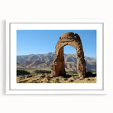 Abstract art print of ancient ruins in muted earth tones on a white framed canvas, suitable for dining room decor.