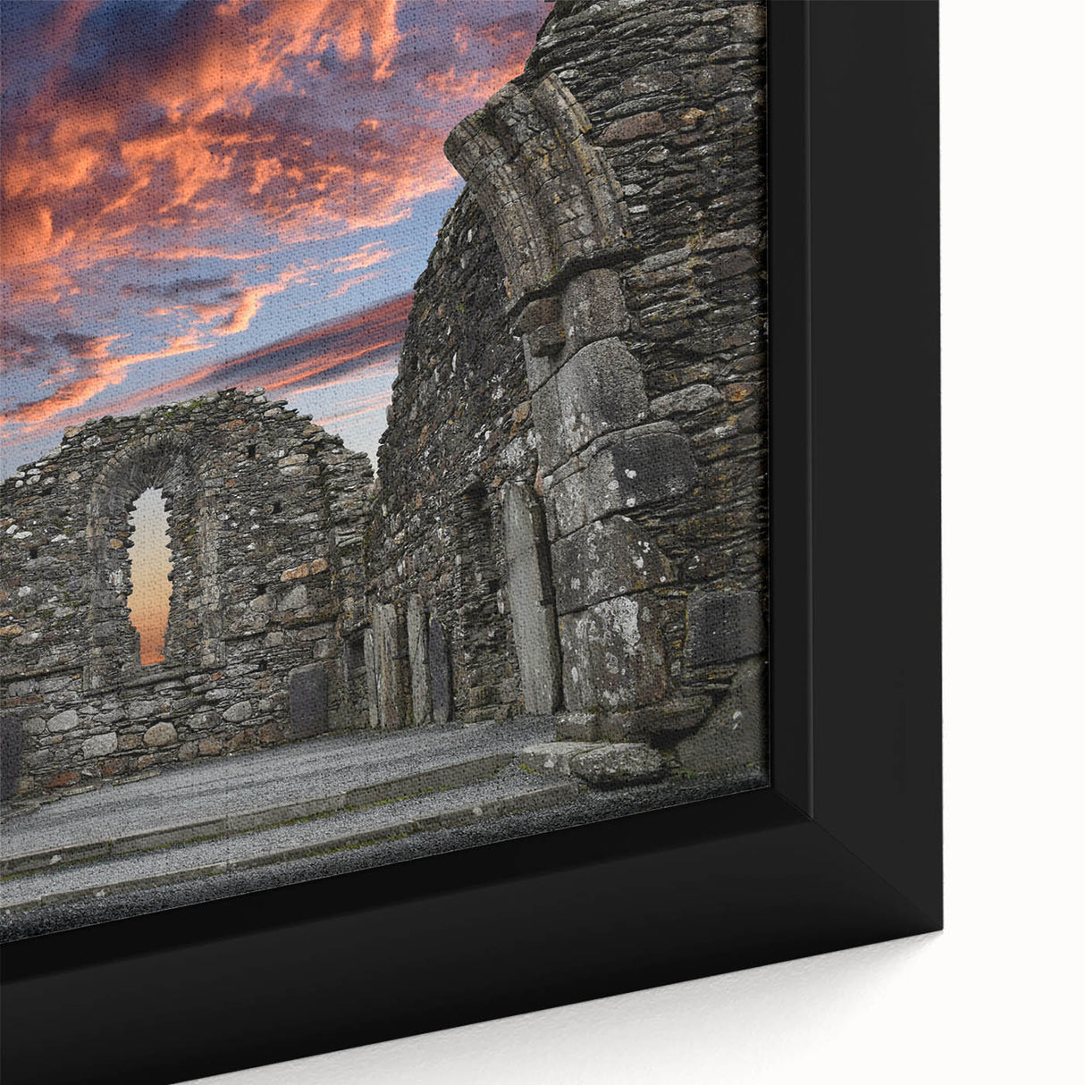 Framed canvas featuring a close-up of ancient ruins in textured black with vibrant color accents.