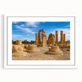 Abstract art print of ancient ruins in muted earth tones on a framed white mat, ideal for dining room decor.