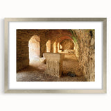 Textured art print of ancient ruins in neutral and earth tones on a framed canvas, suitable for bedroom decor.
