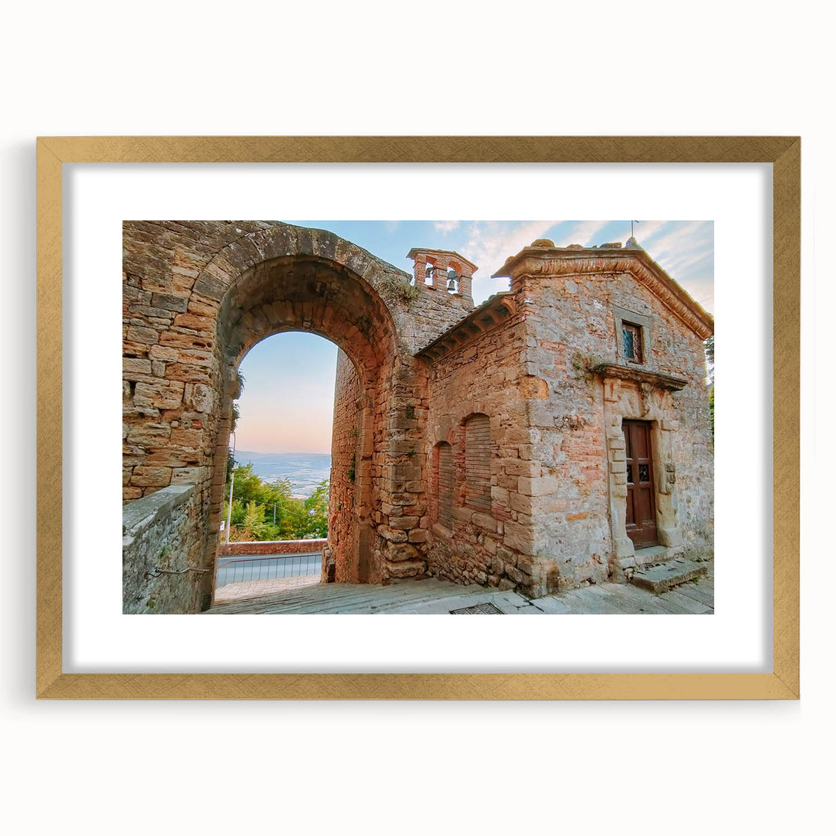 Extra large abstract art print of ancient ruins in muted earth tones on a textured canvas, framed in gold.