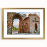 Extra large abstract art print of ancient ruins in muted earth tones on a textured canvas, framed in gold.