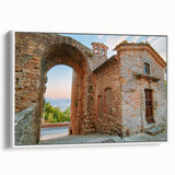 Vintage poster art of ancient ruins in muted earth tones on framed canvas, ideal for living room decor.