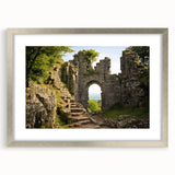 Abstract art print of ancient ruins in muted earth tones on a framed canvas, suitable for dining room or bedroom decor.