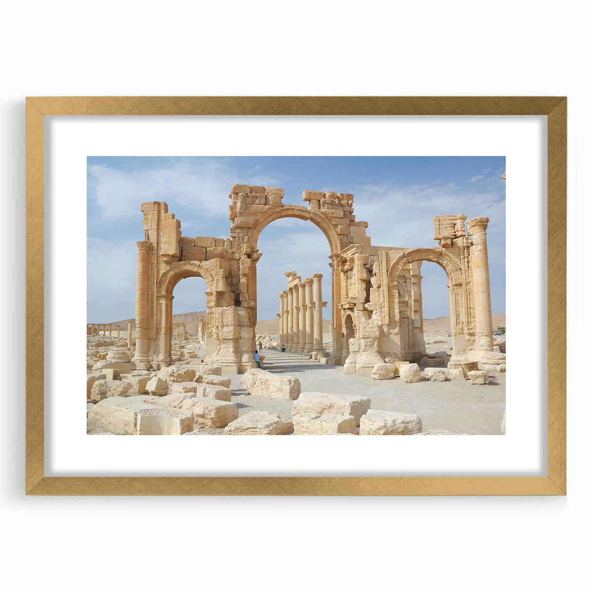 Textured art depicting ancient ruins in muted earth tones on a gold-framed mat, ideal for bedroom decor.