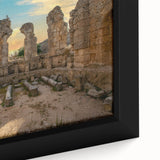 Close-up of a black wall art featuring ancient architecture ruins in colorful, textured design on a framed canvas.