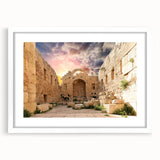 Textured art print of ancient ruins in muted earth tones on a framed white mat, ideal for bedroom art.