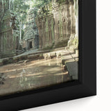 Close-up of a textured black wall art depicting ancient ruins in vibrant colors on a framed canvas.