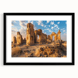 Extra large abstract art print of colorful, textured ancient ruins on a black framed canvas, ideal for living room decor.
