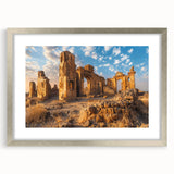 Textured art print of ancient ruins in muted earth tones, framed in silver, ideal for bedroom wall decor.