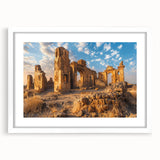 Abstract art print of ancient ruins in muted earth tones on a white framed canvas, suitable for dining room decor.