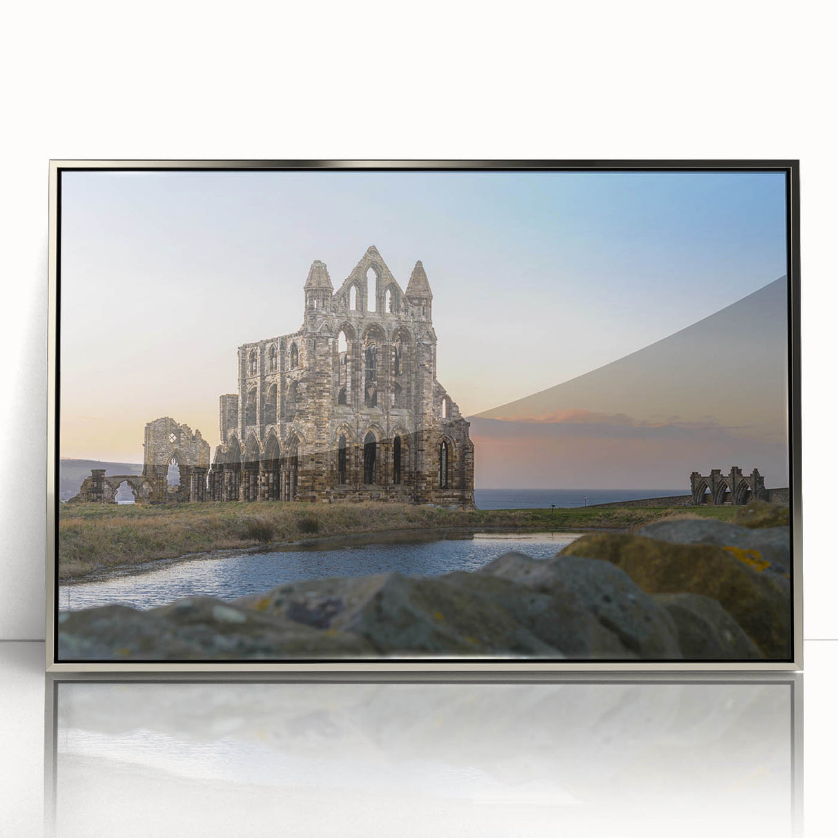 Mid-century modernist art depicting ancient ruins in muted earth tones on a silver-framed acrylic print.