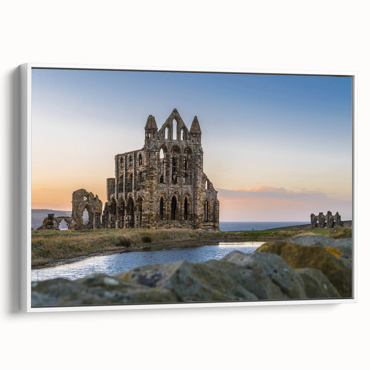 Framed canvas of ancient ruins in muted earth tones, ideal for adding a vintage touch to office spaces.