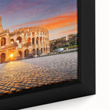 Close-up of a black framed canvas featuring colorful, textured depiction of ancient ruins.