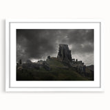 Textured art print of abstract ancient ruins in muted earth tones on a framed white mat, suitable for bedroom decor.
