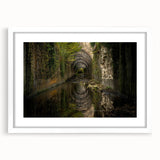 Abstract art print of ancient ruins in muted earth tones on a white-framed mat, suitable for bedroom or dining room decor.