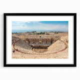 Colorful art print of abstract ancient ruins in vibrant hues, textured on a large black-framed canvas.
