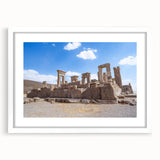 Abstract art print of ancient ruins in muted earth tones on a framed white mat, ideal for dining room decor.