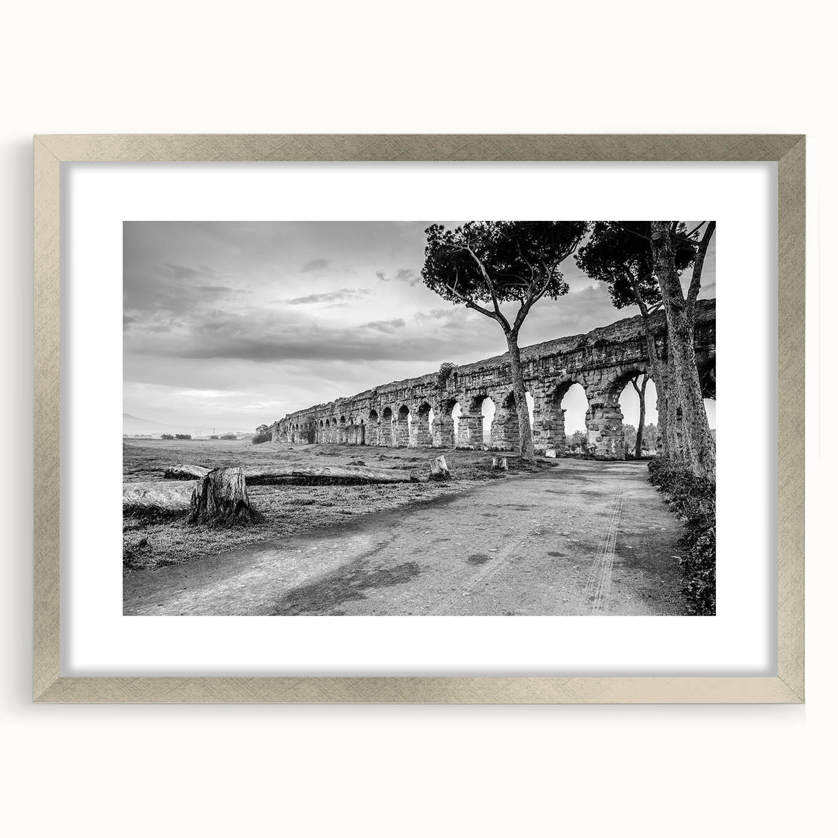 Textured art depicting abstract arches in muted gray, framed in silver, ideal for modern bedroom ambiance.
