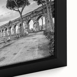 Close-up of black wall art featuring colorful, textured arch designs on a framed canvas, ideal for living room decor.