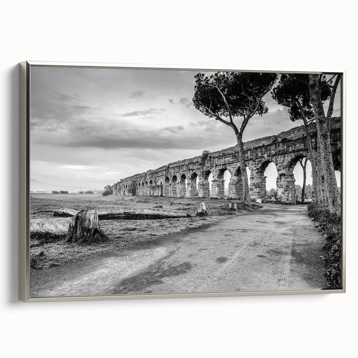 Framed canvas landscape art painting featuring colorful vintage poster art of black architectural arches.