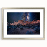 Abstract art print featuring symmetrical arch designs in monochrome tones, framed in silver, suitable for dining room decor.