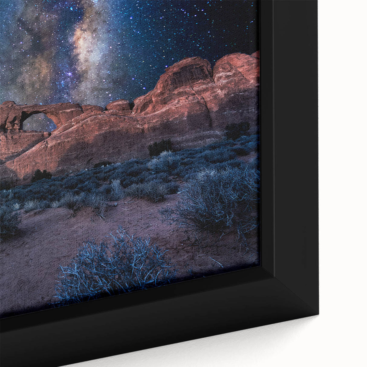 Close-up of black wall art featuring colorful, textured arches on a framed canvas, ideal for living room decor.