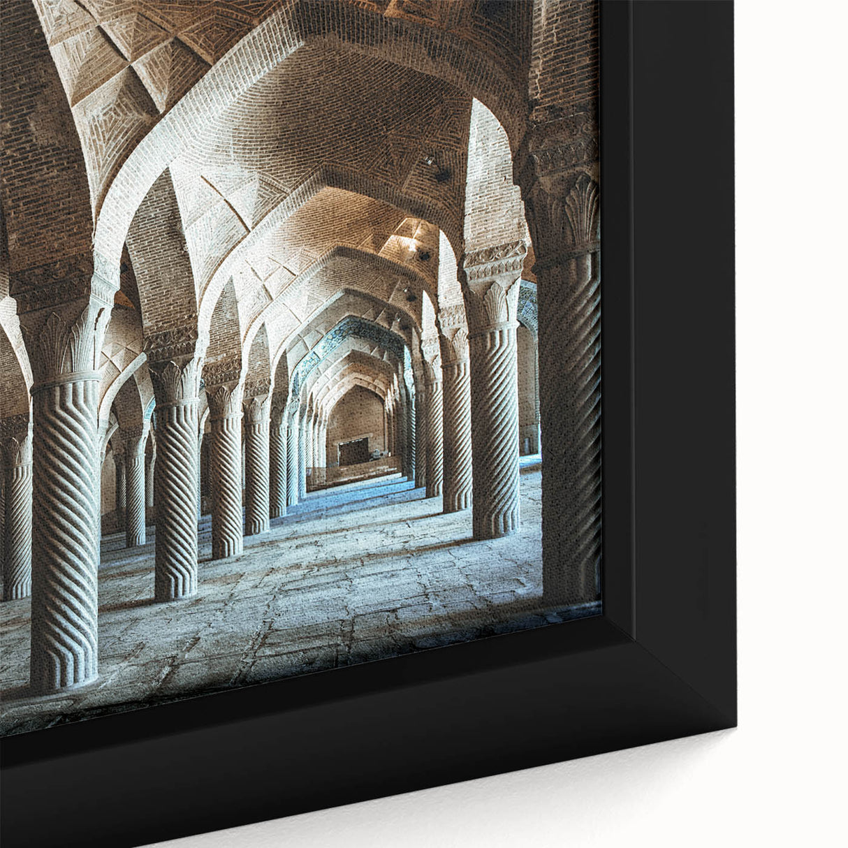Close-up of a black wall art on framed canvas featuring colorful, textured arch designs.