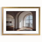 Abstract art print of architectural arches in muted gold and white, framed with a gold mat.