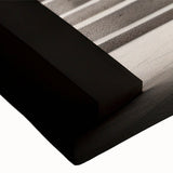 Large art depicting an archway in a landscape, rendered in black and white on a stretched canvas.