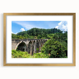 Abstract art print featuring geometric arches in gold and black, framed with a matte finish.