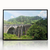 Large abstract wall art featuring black and white arches in a mid-century modernist style, acrylic print framed in black.