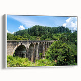 Framed canvas featuring a black and white vintage poster of landscape art paintings with colorful art accents.