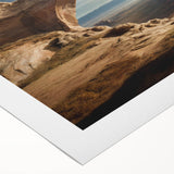 Art deco poster featuring symmetrical arch designs in muted gold and cream tones on rolled canvas.