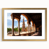 Abstract art print featuring interconnected arches in muted gold and white, framed in gold.