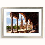 Textured art print of architectural arches in muted gray, framed in silver, ideal for modern bedroom ambiance.