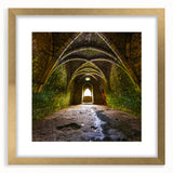 Abstract art print depicting stylized arches in gold and black, framed with mat, suitable for dining room decor.