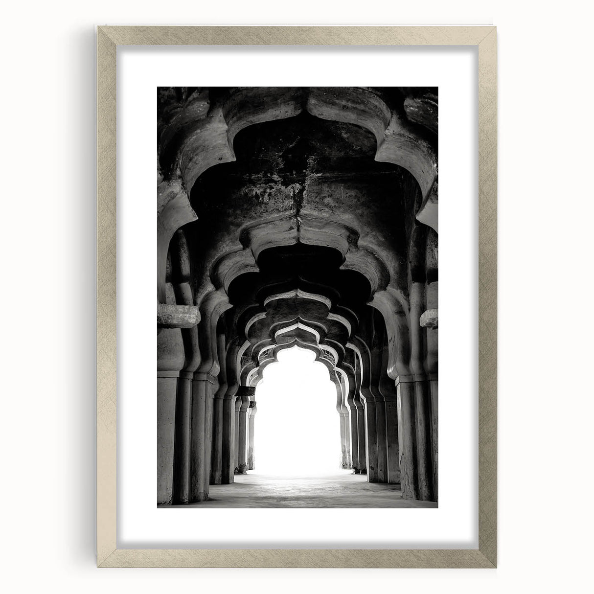 Textured art of abstract arches in muted earth tones, framed in silver, suitable for bedroom decor.