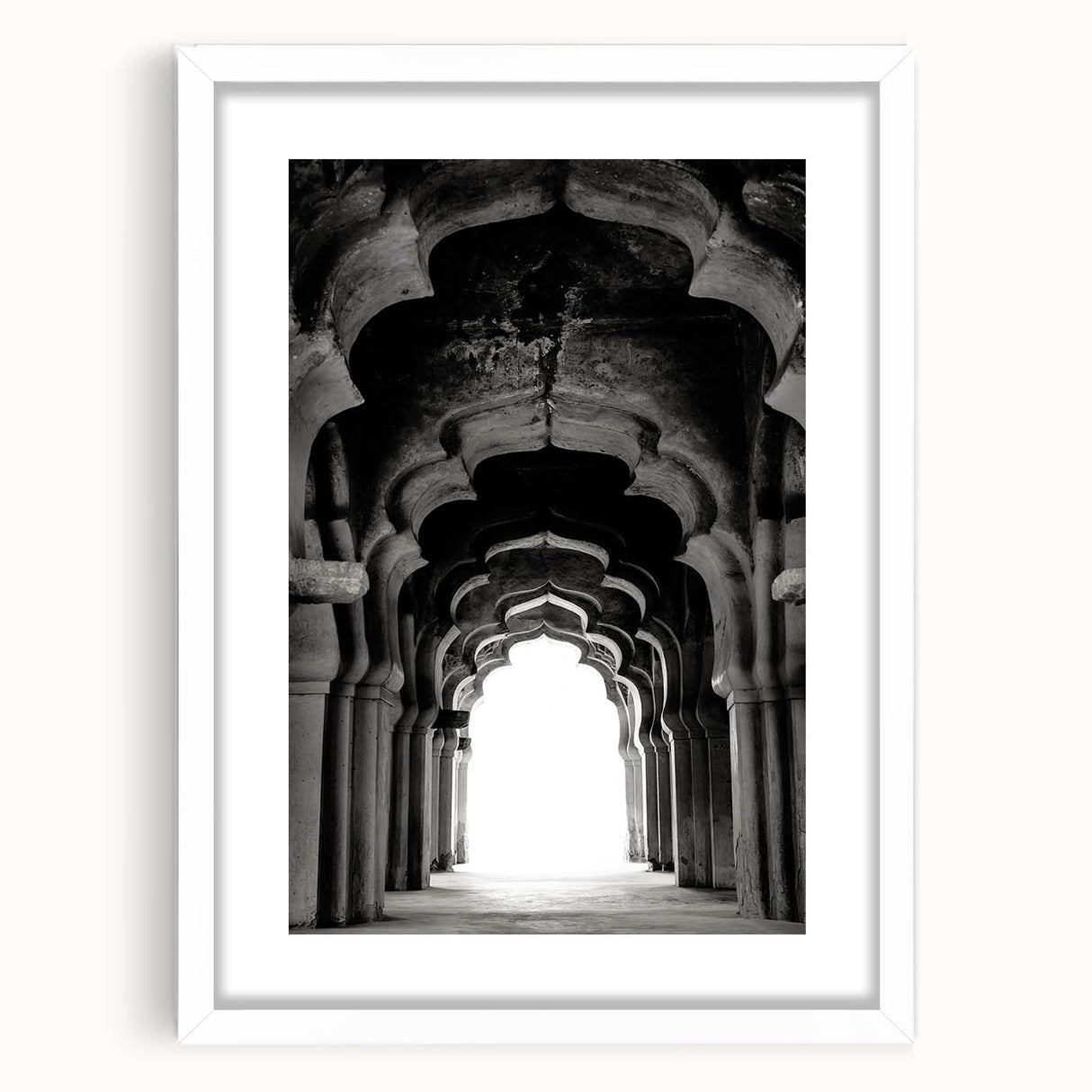 Abstract art print featuring textured arches in neutral tones, framed in white.
