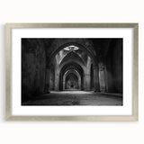 Textured abstract art print depicting arches in muted gray tones on a framed silver mat, ideal for bedroom decor.